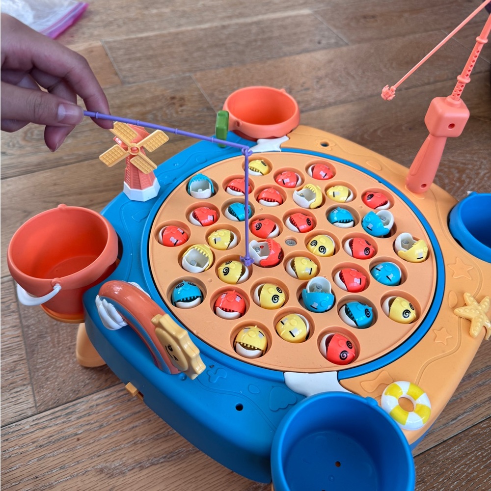 Used 80% new Vibrant Fishing Game with Rods and Fish